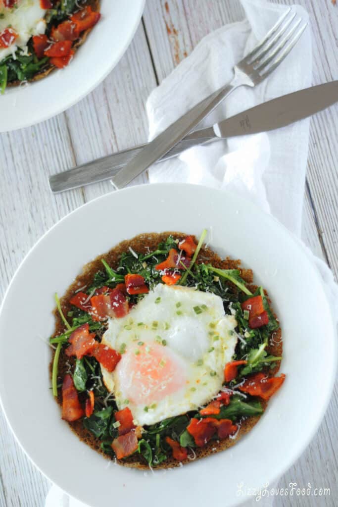plate with crepe, kale, egg