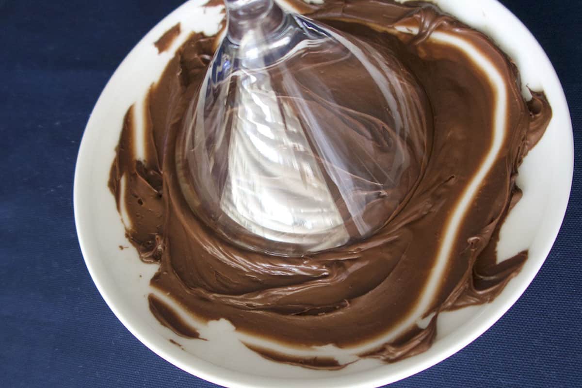 swirling trim of glass with chocolate